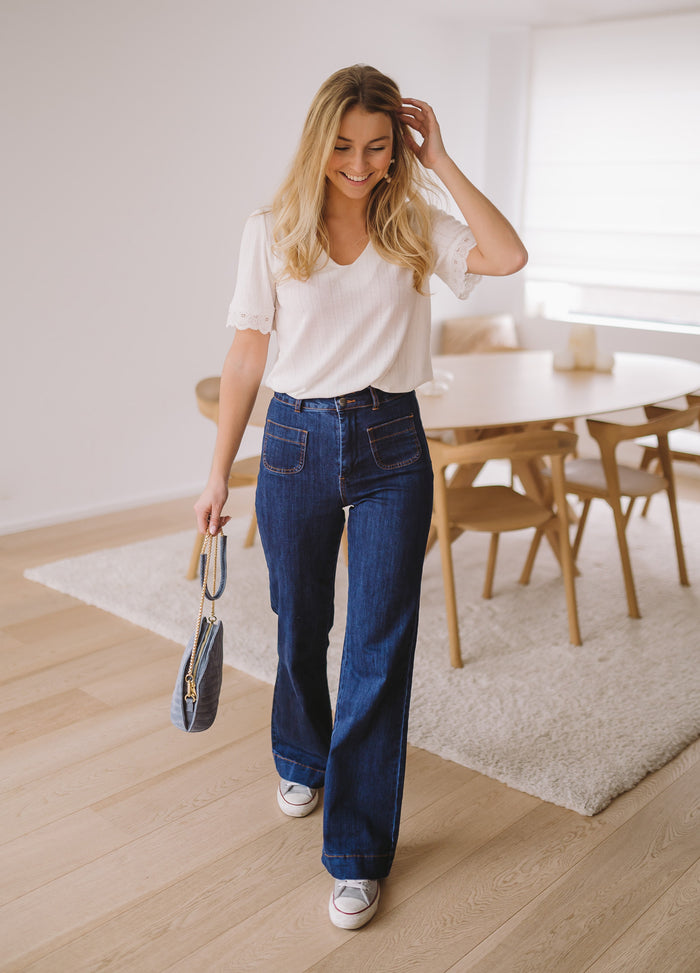 Dark blue Hugues flared denim showing two-button front