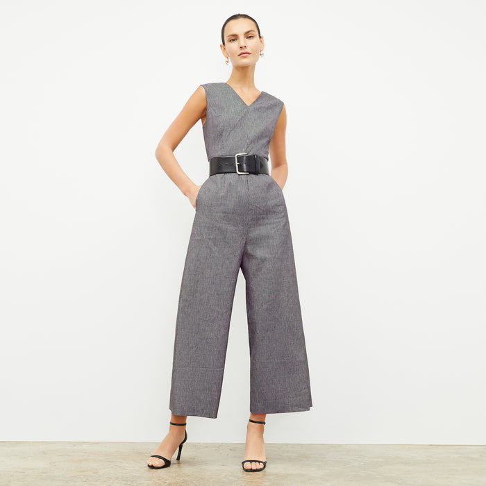 front image of a woman wearing the demi jumpsuit in gingham linen | Lead