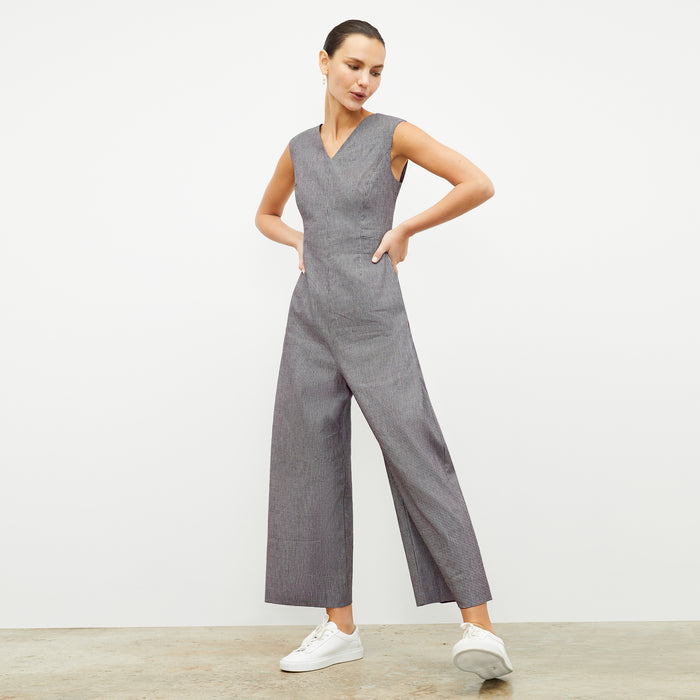 front image of a woman wearing the demi jumpsuit in gingham linen
