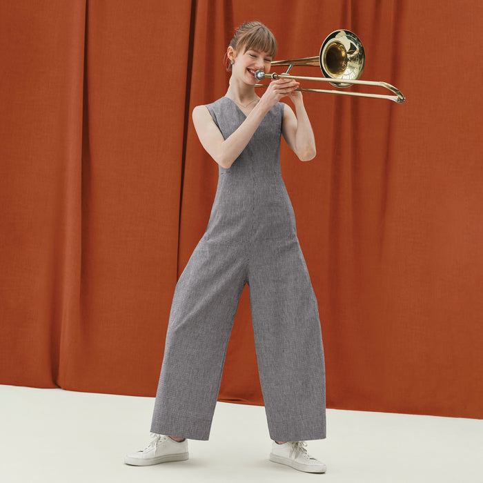 front image of a woman wearing the demi jumpsuit in gingham linen