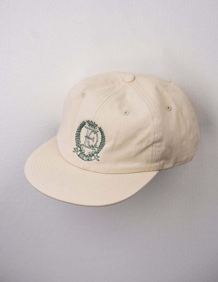 Close-up of embroidery on off-white  Éclectique crest embroidered dad hat