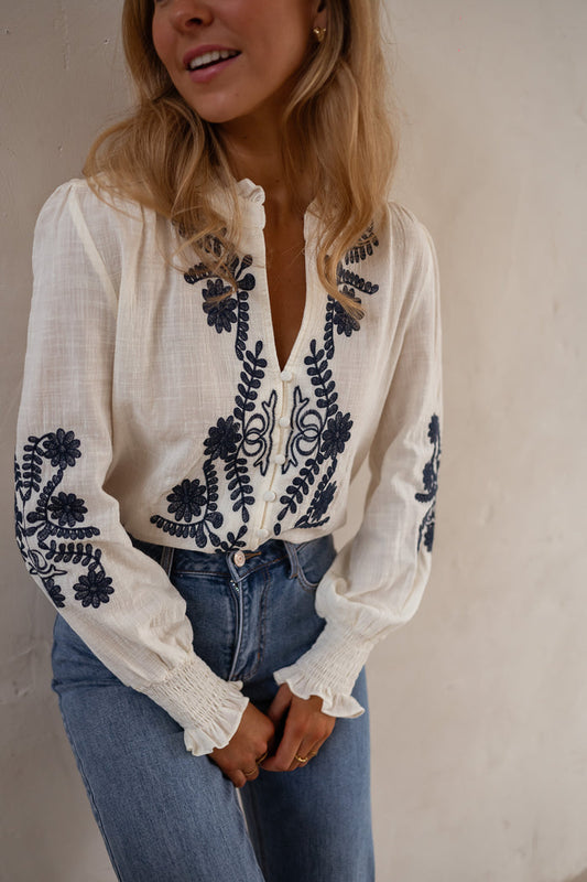 Ecru and Blue Embroidered Salome Blouse, V-neck blouse with blue floral embroidery, front view