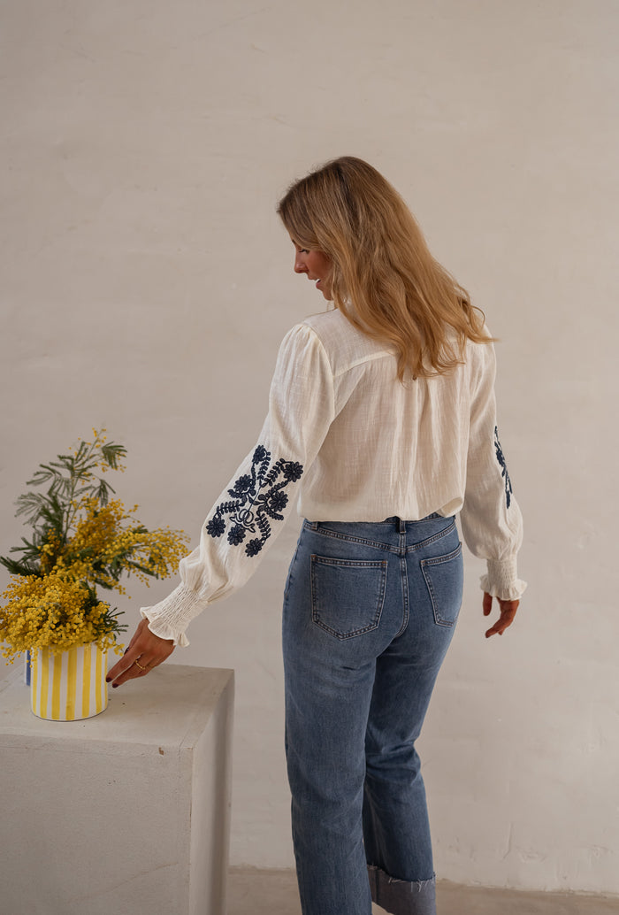 Ecru and Blue Embroidered Salome Blouse blue floral embroidery detail, close view