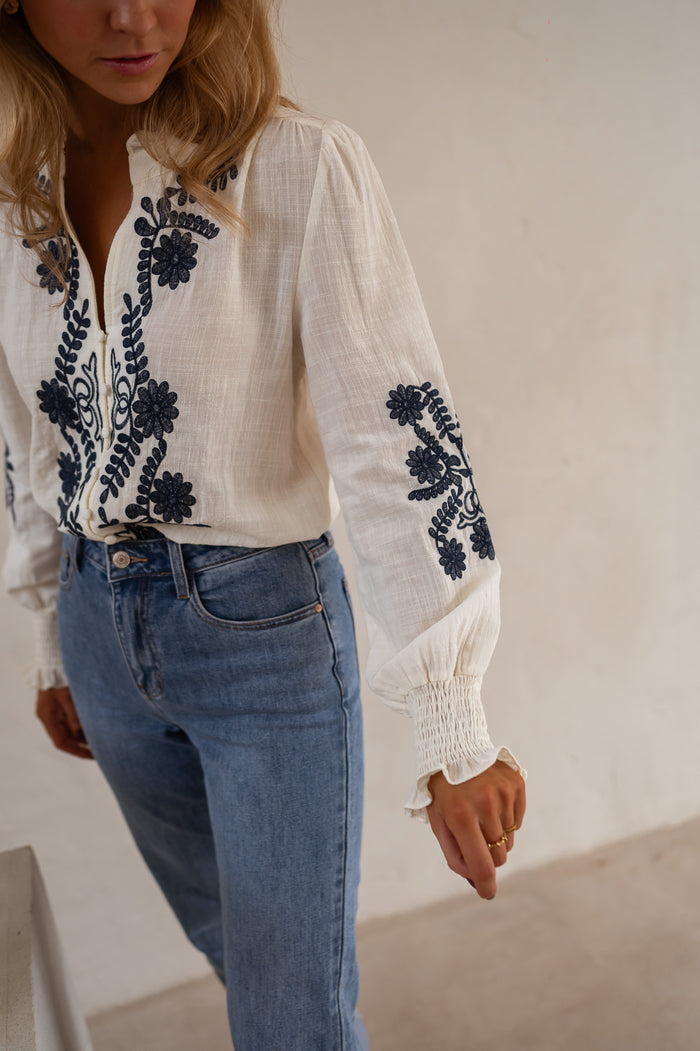 Ecru and Blue Embroidered Salome Blouse side view, light unlined fit