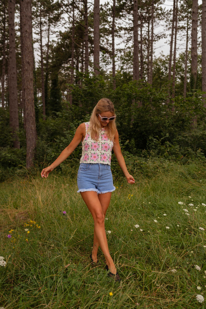 Model wearing ecru and pink Alisha crochet top