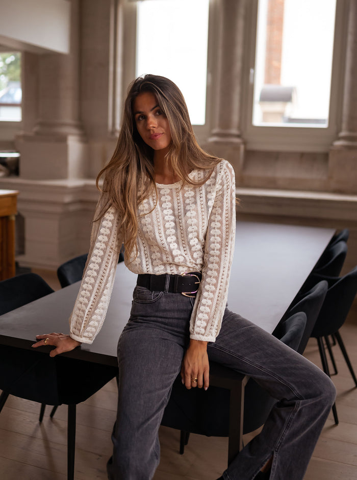 Woman wearing ecru lace blouse
