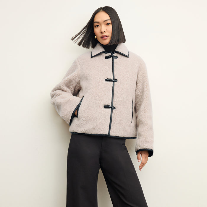 Front image of a woman wearing the eli jacket in travertine | Lead