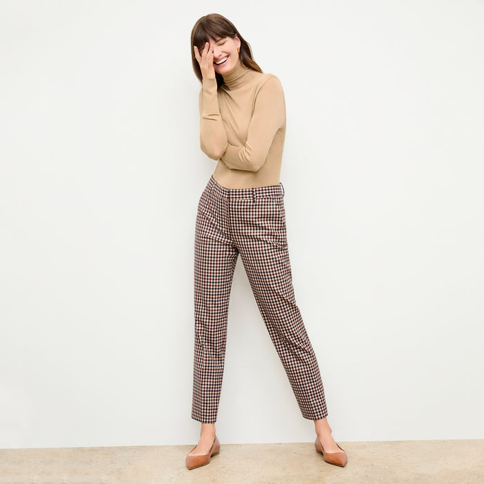 front image of a woman wearing the elizabeth turtleneck in camel