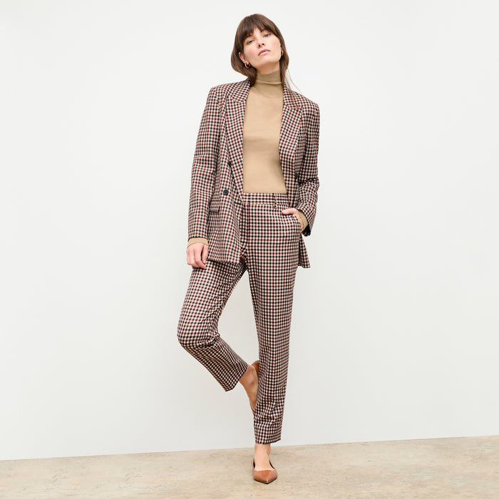 front image of a woman wearing the elizabeth turtleneck in camel
