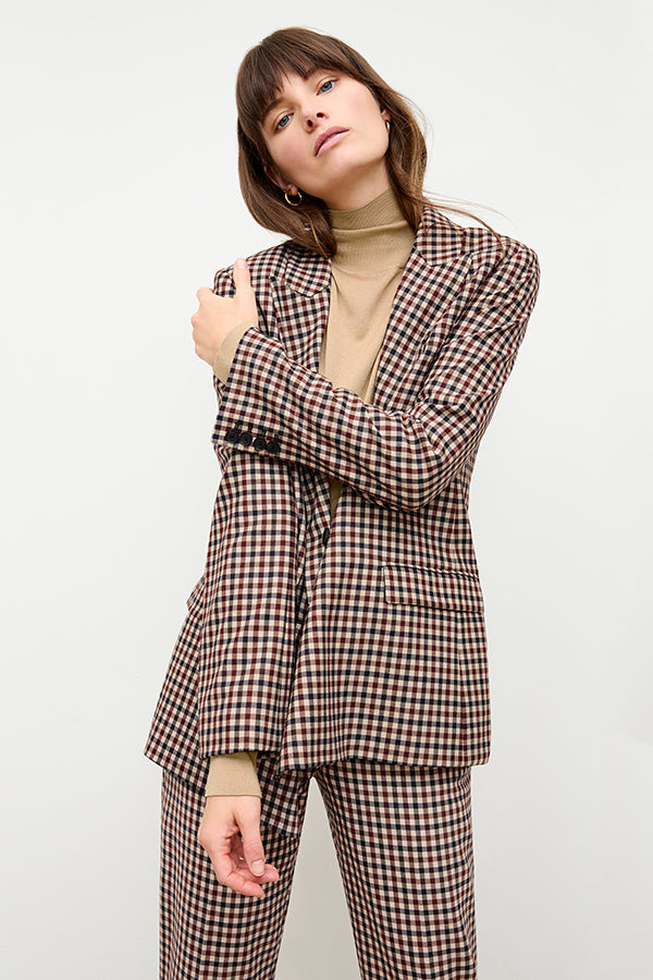 front image of a woman wearing the elizabeth turtleneck in camel | Exclude | Grid Hover