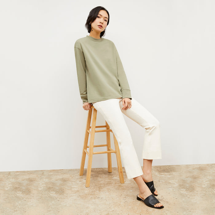 Front image of a woman wearing the Ellie Pullover - Light French Terry in Laurel Green | Lead