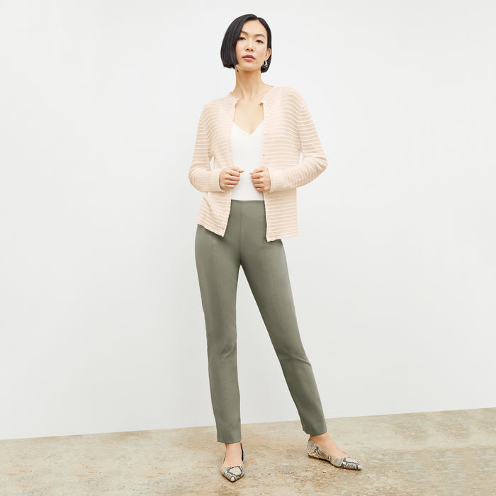 Front image of a woman standing wearing the Emerson Cardigan in Meringue | Lead