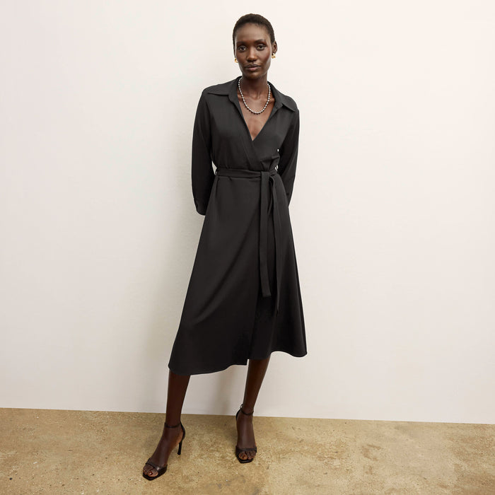 front image of a woman wearing the emmett dress in black | Lead