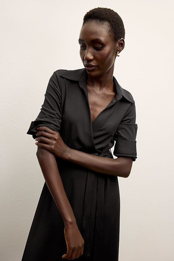 front image of a woman wearing the emmett dress in black | Exclude | Grid Hover