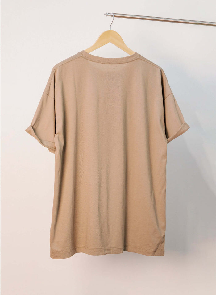 Japanese Made Back view of the Essential Cotton T-shirt in sand, showcasing its relaxed fit and soft fabric.