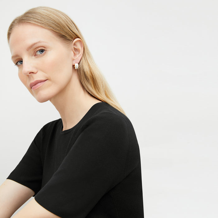 image of a woman wearing the esti earring