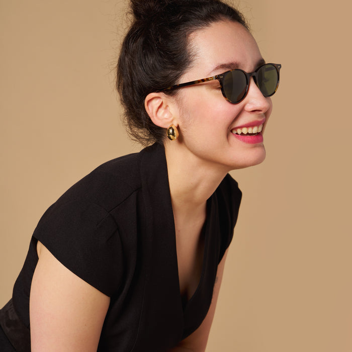 mood image of a woman wearing the felisa dress in black