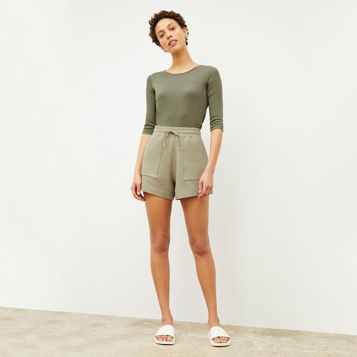 Front image of a woman wearing the Felix Short - Light French Terry in Laurel Green