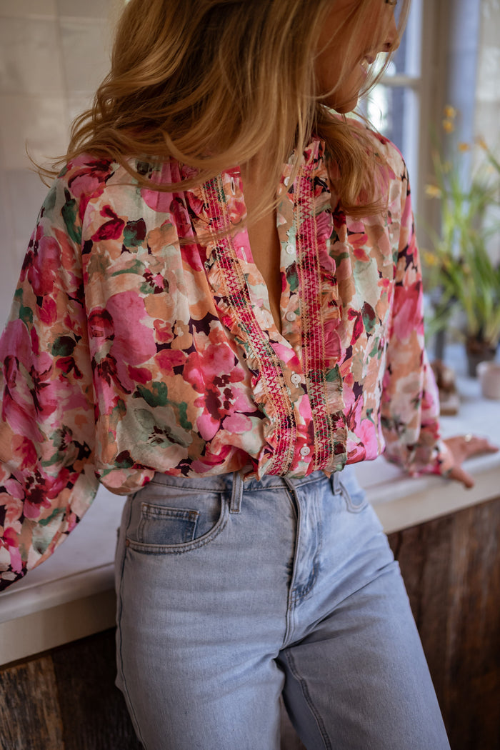 Pink floral Elvina blouse with ruffle placket, front view