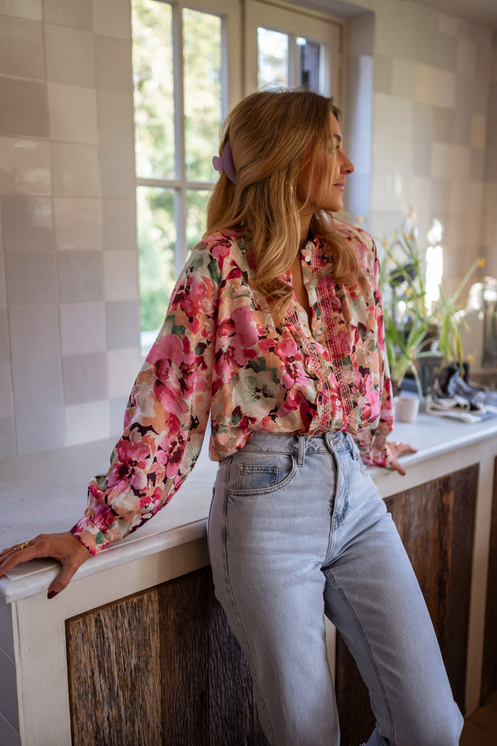 Watercolor floral button-front blouse styled with jeans, side