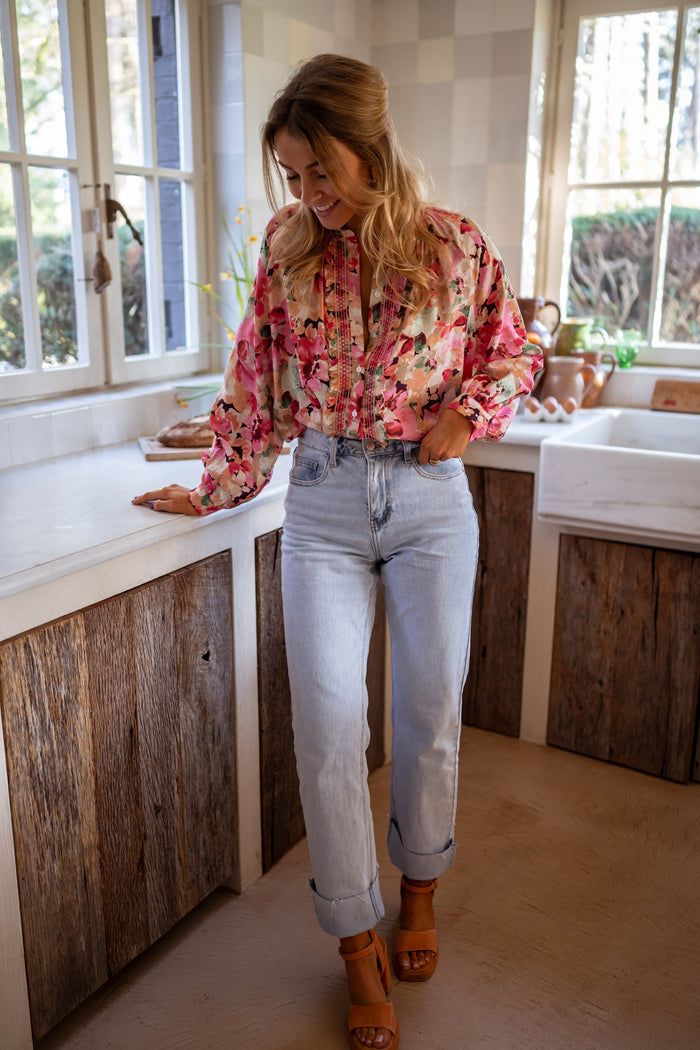 Flowy floral button-front blouse with ruffle trim, detail view