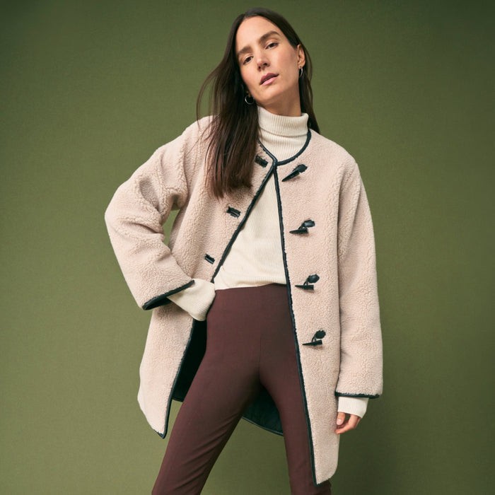 front image of a woman wearing the foster pants in Mahogany