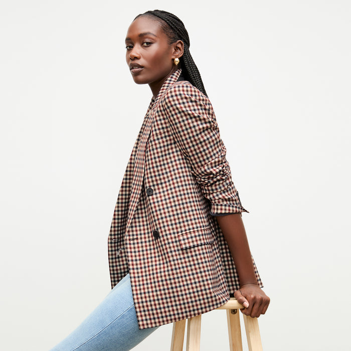 front image of a woman wearing the frame denim le high skinny raw after jean in galeston
