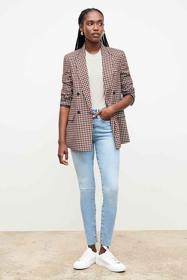 front image of a woman wearing the frame denim le high skinny raw after jean in galeston | Exclude | Grid