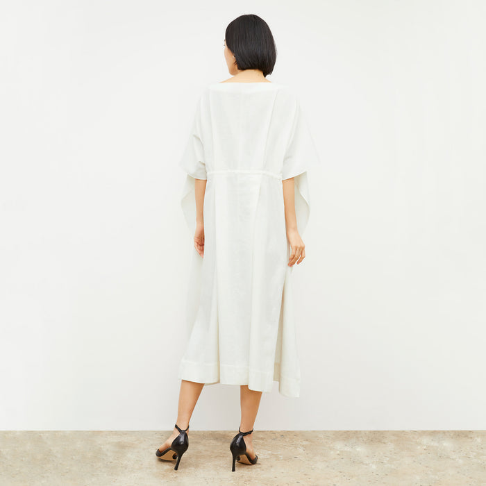back image of a woman wearing the Freedlund Caftan in Ivory
