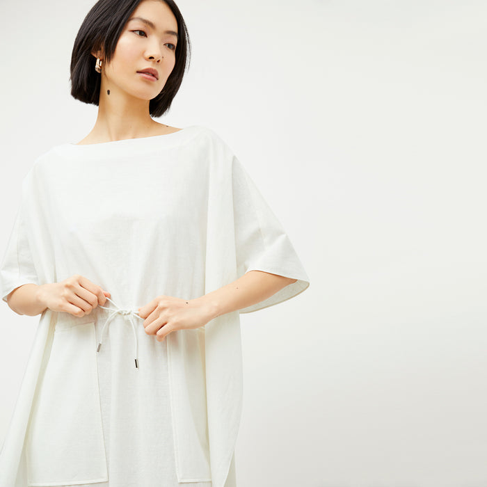 detail image of a woman wearing the Freedlund Caftan in Ivory