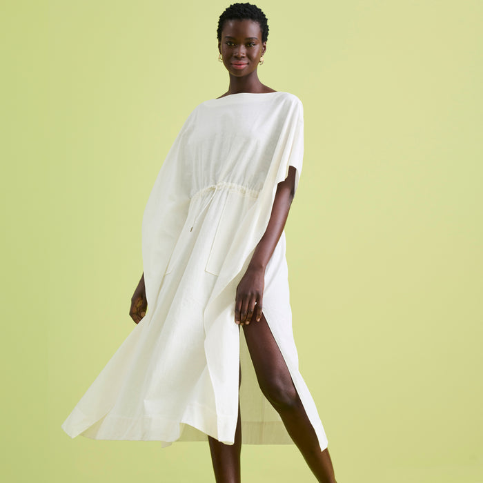 Front image of a woman wearing the Freedlund Caftan in Ivory