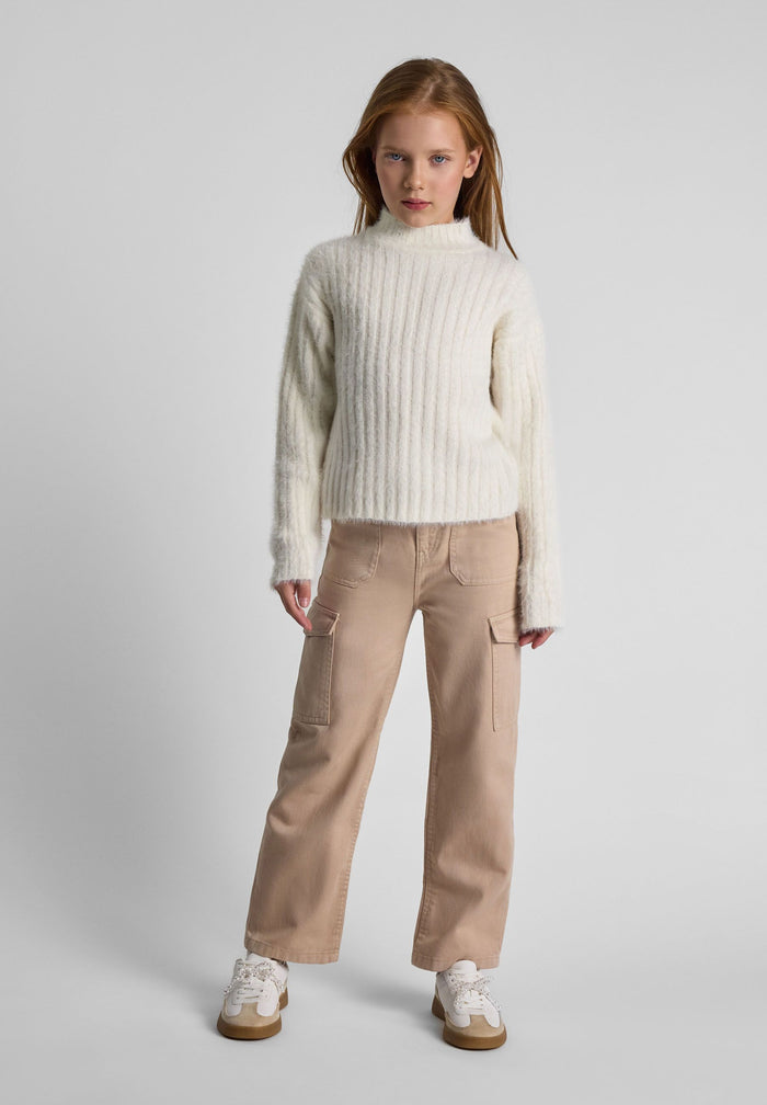 Girls cream jumper with high neck, ribbed texture, and long sleeves.