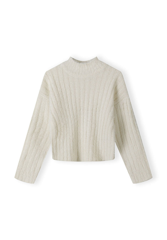 Girls cream jumper with high neck, ribbed texture, front view.
