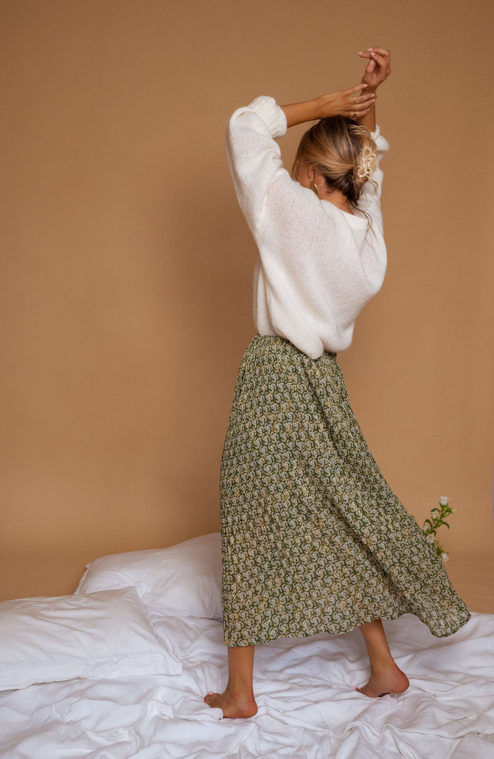 Model wearing green Moriane maxi skirt
