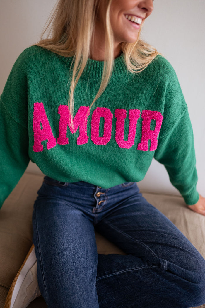 Green sweater with pink AMOUR logo