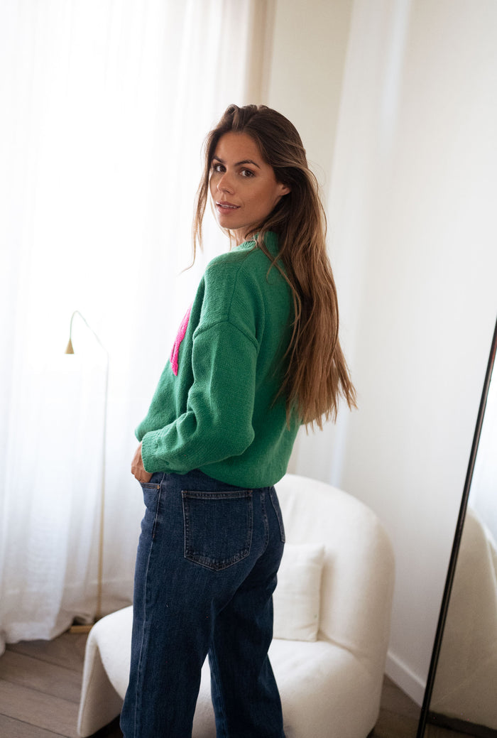 Green AMOUR sweater styled with jeans