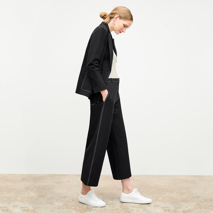 side image of a woman wearing the grenville jacket in black