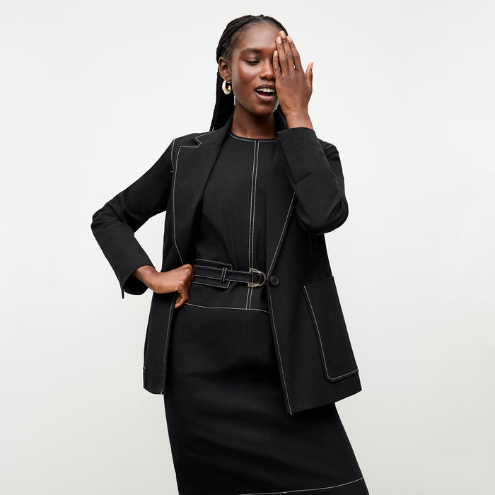 front image of a woman wearing the grenville jacket in black
