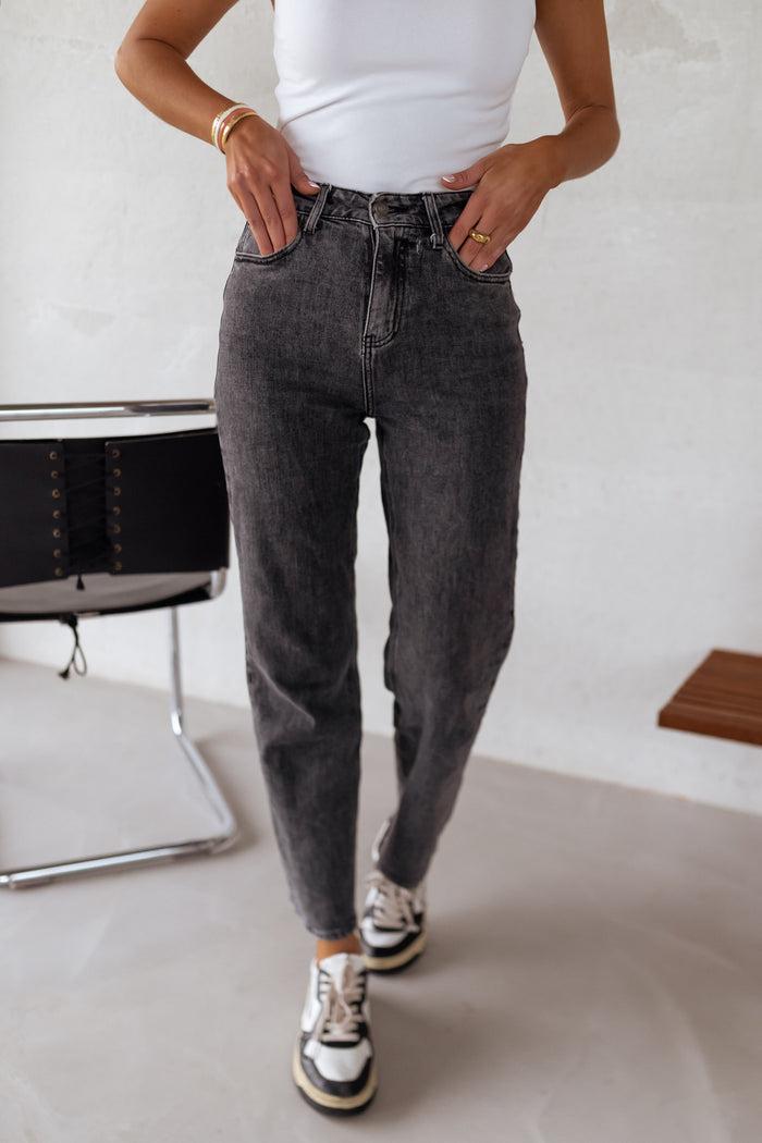 Woman wearing grey straight jeans