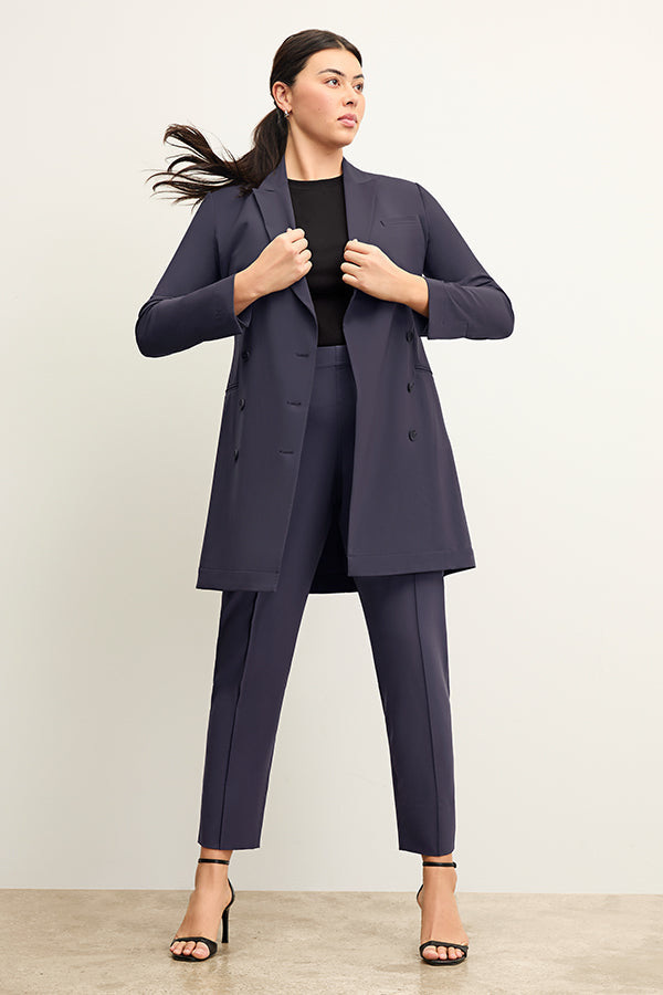 back image of a woman wearing the gwynne dress in cool charcoal | Exclude | Grid Hover