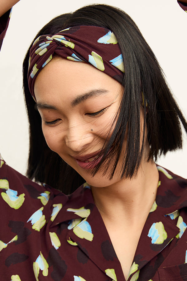 front image of a woman wearing a headband in bengal print | Exclude | Grid