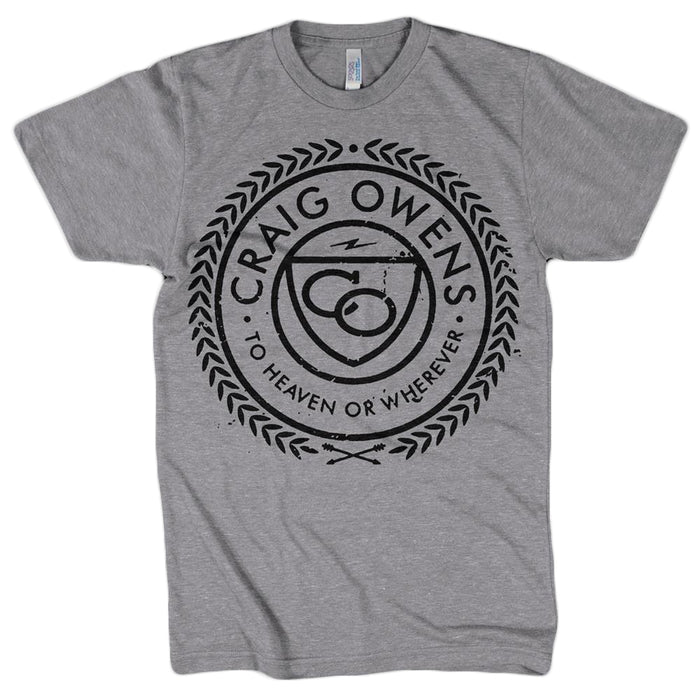 Craig Owens gray t-shirt with a circular black design, Craig Owens and To Heaven or Wherever text, a central stylized symbol, and laurel wreath accents around the circle.