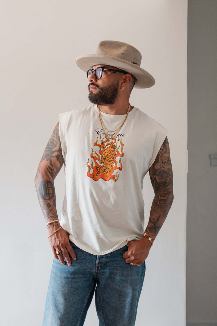 Man wearing a Jaguar Graphic T-shirt with flaming jaguar artwork and hat, showcasing modern casual style.