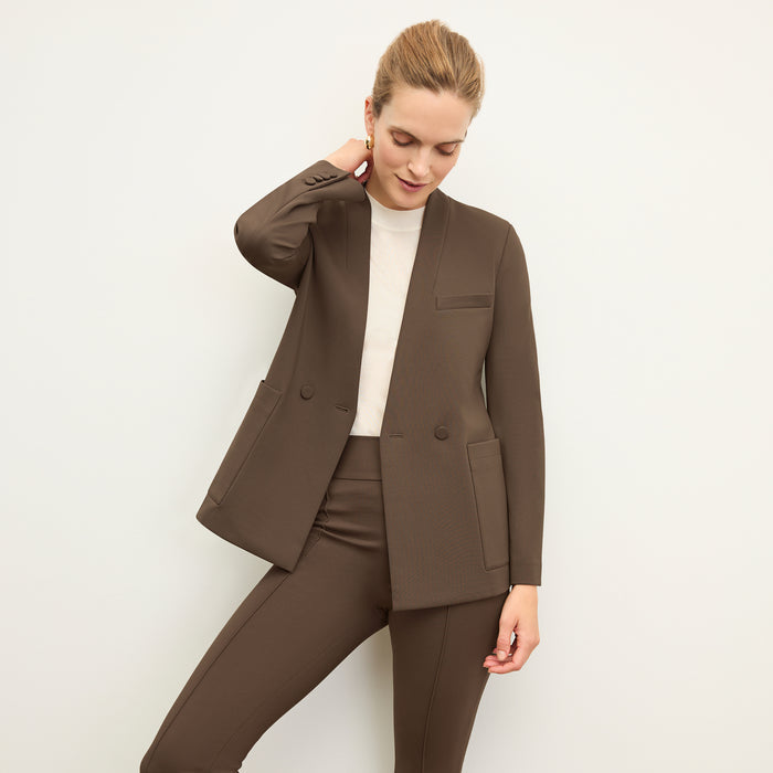 front image of a woman wearing the janette jacket in ash