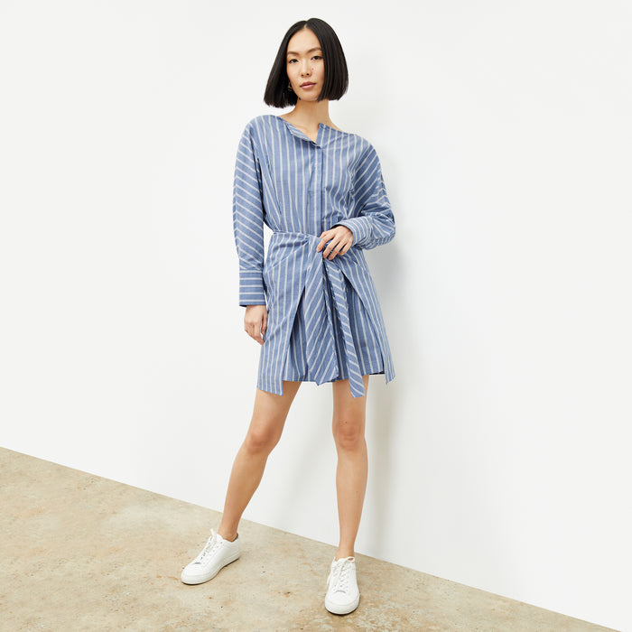 front image of a woman wearing the janie dress in poplin stripe