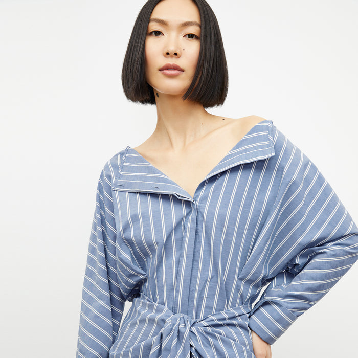 front image of a woman wearing the janie dress in poplin stripe