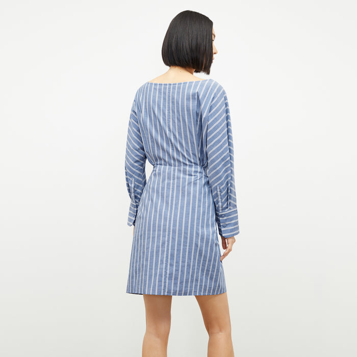 back image of a woman wearing the janie dress in poplin stripe