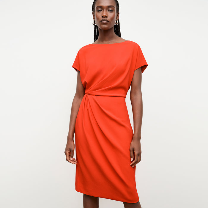 front image of a woman wearing the jillian dress in bright coral | Lead