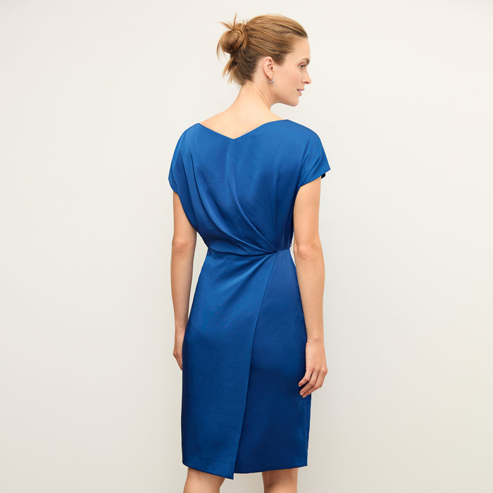 Back image of a woman wearing the jillian dress in sapphire