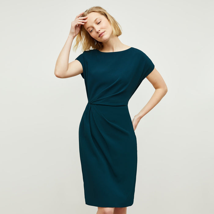 Front image of a woman standing wearing the Jillian Dress in Rainforest | Lead